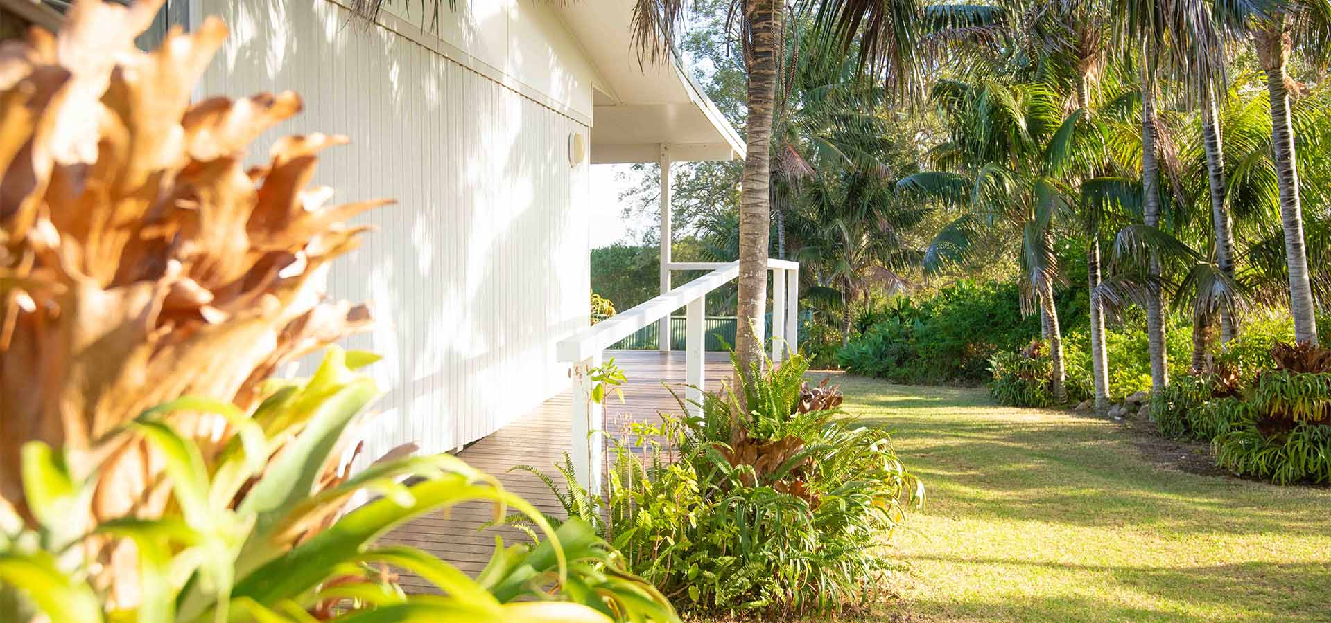 outdoor garden near house with deck and ramp